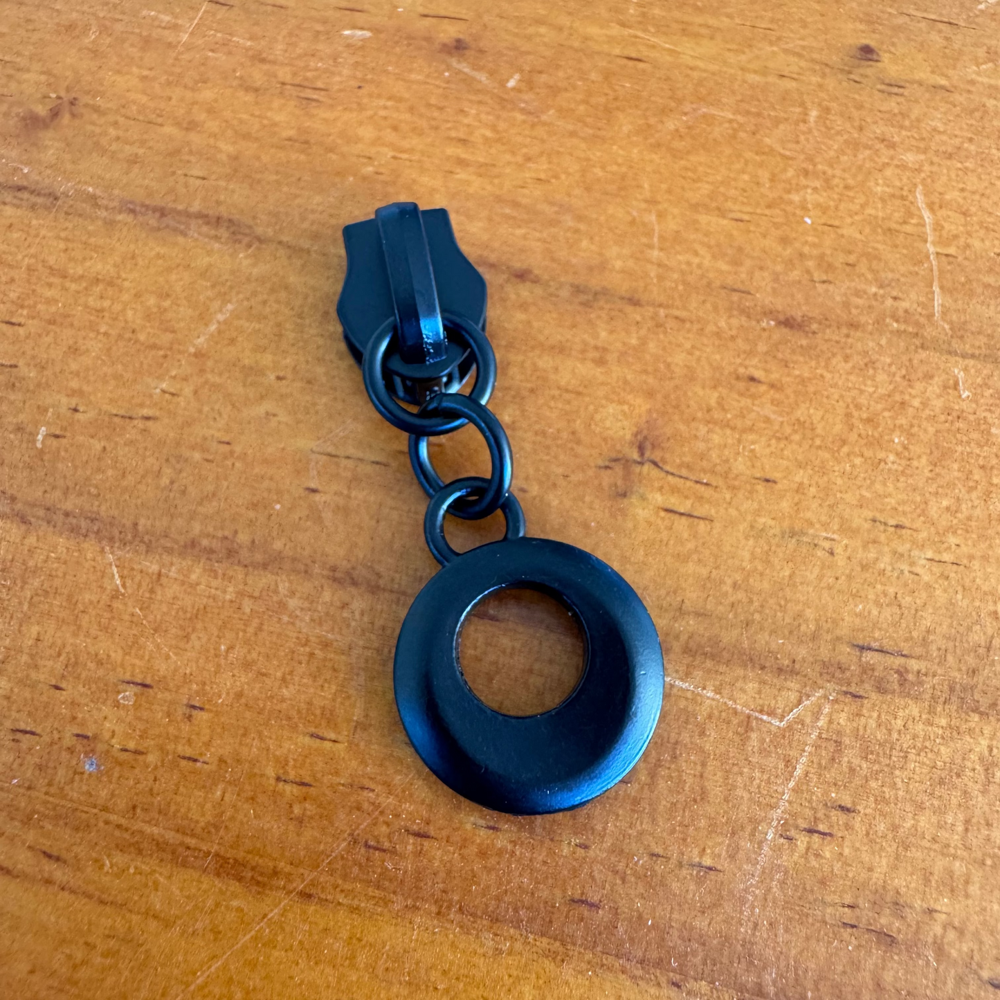 Bag making zipper pulls circular matte black