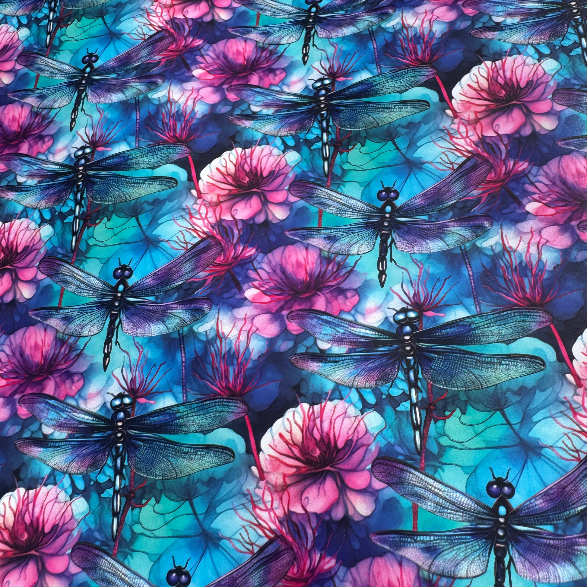 Pattern of dragonflies and pink flowers on a blue and purple background