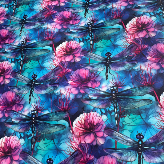 Pattern of dragonflies and pink flowers on a blue and purple background