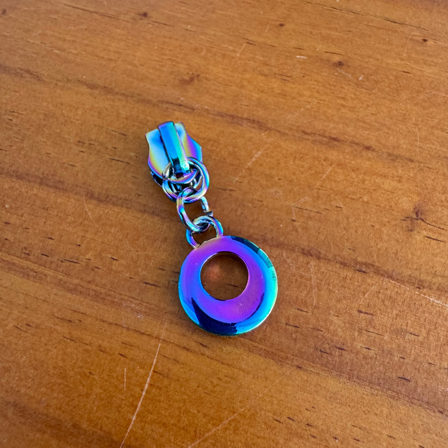 Bag making zipper pulls circular rainbow