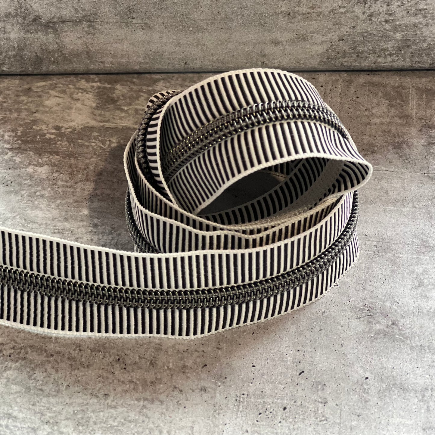 #5 zipper tape black stripe with Gunmetal teeth 1, 3, and 5 metre bundles available